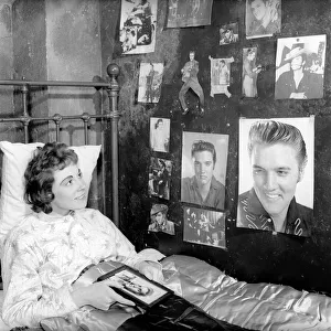 Youth Culture: Miss Robinson who has decorated her bedroom with pictures of Elvis Presley
