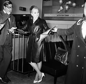 Hungarian Prints: Zsa Zsa Gabor reads an article in the Daily Mirror regarding a dispute she had in Monte